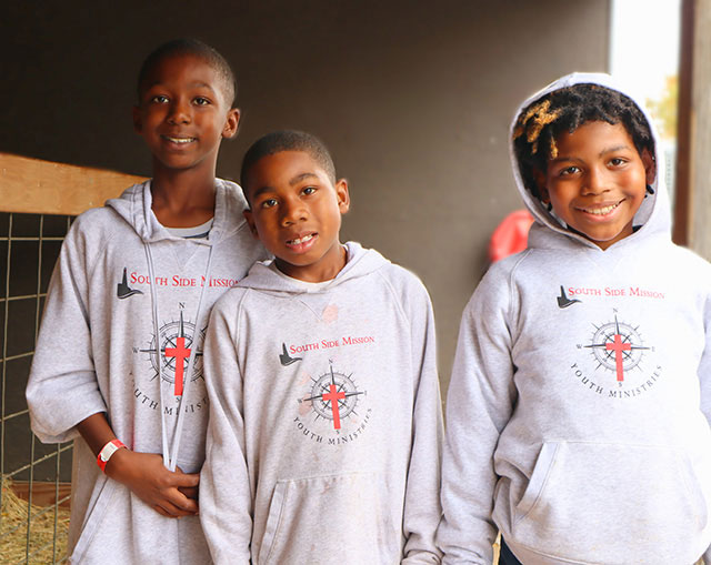 Three young parishioners from South Side Mission.