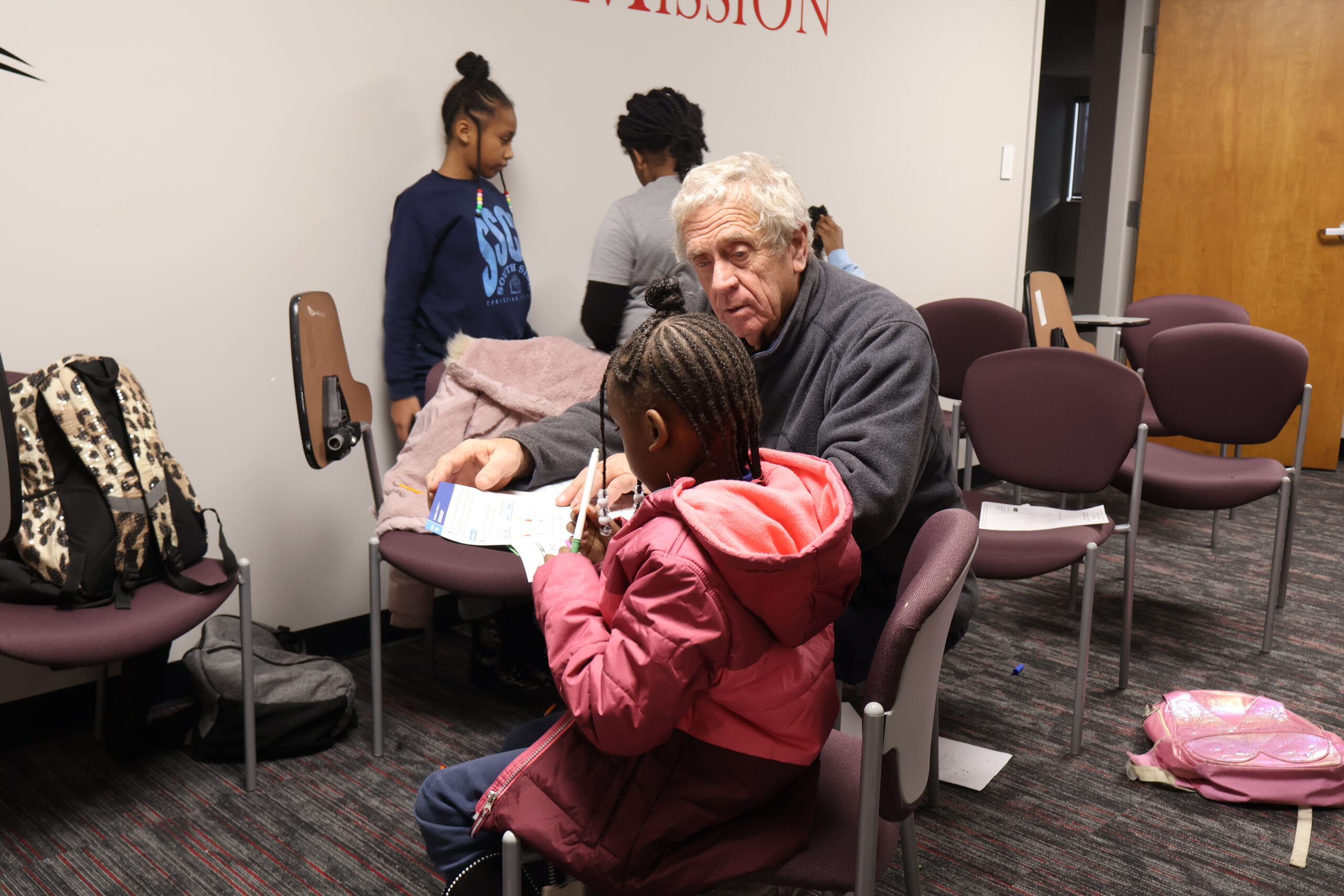 Volunteer tutoring young children